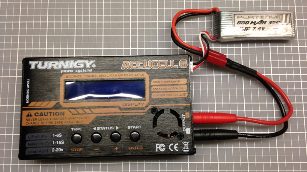 7.4V battery pack used for this setup  shown connected to the charger  between usage.