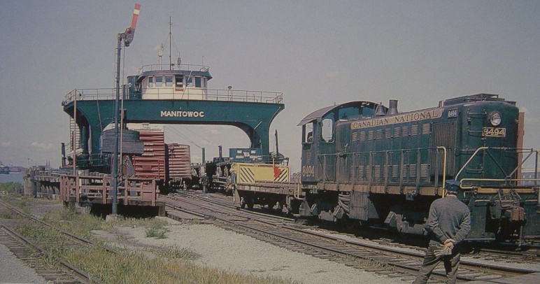 Canadian National unloading on the Canada side. Note the use of an idler car.